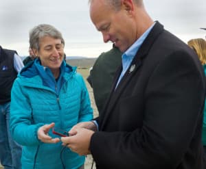Gov. Matt Mead views a photograph Secretary of the Interior Sally Jewell has just taken of antelope migrating near Trappers Point in Sublette Ccounty last fall. In 2013, Mead vetoed portions of a federal land transfer study that would have funded his staff's involvement, citing a legal analysis by his attorney general. Jewell's agency oversees the BLM, which manages more than 17 million acres of federal property in Wyoming that some lawmakers would like to see turned over to the state. (Angus M. Thuermer Jr/WyoFile)