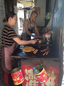 Food workers prepare for the lunch hour in Taiyuan, in China's coal-producing region. (Dustin Bleizeffer/WyoFile)