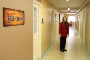 Republic Free Choice is located across the hall from the Wyoming Liberty Group. RFC and several other independent groups sent out mailers in the 2014 election. Policy advisor and lobbyist Maureen Bader, at right, works for the Wyoming Liberty Group on revenue and taxation issues. (Gregory Nickerson/WyoFile)