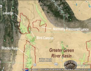 This map of energy development in the Green River Basin shows how greater sage grouse that winter in the proposed NPL gas field are almost surrounded by other energy development. An interactive map at the Wyoming Geological Survey website describes the existing (green) and planned developments (red outlines). (Wyoming Geological Survey).