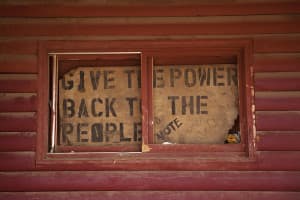 A sign posted in the window of the Chicken Coop in Lame Deer, Montana shows that Northern Cheyenne tribal members are looking for a change