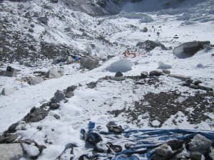 All that is left of a tent that sat at base camp on Mount Everest are a pair of sandals. (courtesy Darren Rogers)