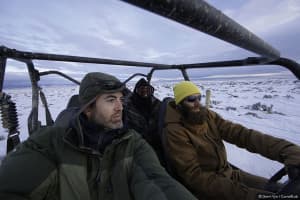 Gerrit Vyn, principle videographer (left), and Marc Dantzker, producer ride with assistant Jamie Drysdale while working on the film "Sagebrush Sea." (Courtesy Gerrit Vyn)