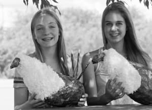 Maggie Majhanovich and Nora Legerski show off their paper grouse they used to help draw birds away from oilfield noise. Their experiment with a Game and Fish Department biologist may help recover dwindling populations near developed areas. (Angus M. Thuermer Jr/WyoFile)