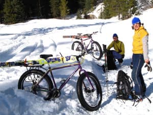 Scott and Jannine Fitzgerald use fat bikes to access a backcountry ski in Teton Canyon near Alta, Wyoming. (courtesy Tim Young)