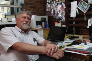 John Freeman at desk