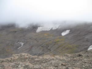 Melting ice patches are often difficult to reach. Yet they are capable of preserving organic materials and items left behind by ancient cultures. (courtesy Yellowstone National Park) 