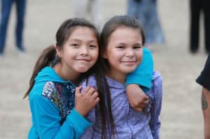Two young girls enjoying the Norther Arapahoe horse culture program in June. (courtesy HHS Office of Minority Health)