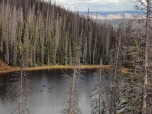 John Calder works on Lake Eileen in Colorado. Calder took mud samples from the lake to determine when large fires burned in the area. (courtesy John Calder)