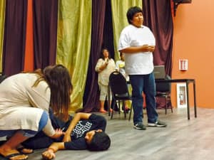 Teens members of the Wind River Unity Council put on a skit in which a patient dies while waiting for paperwork to be completed — a perception of health services tied up in bureaucratic knots. (courtesy HHS Office of Minority Health)