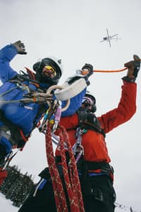 Teton County Search and Rescue volunteers work below a helicopter during a training exercise. (courtesy Andy Bardon)