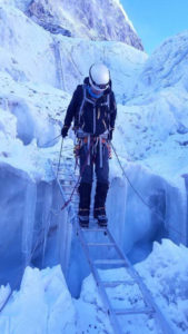 Rogers picks his way across a ladder over a crevasse during his recent expedition to Mount Everest. The mountain's ice features are among it's most treacherous terrain. (Photo courtesy of Darren Rogers)