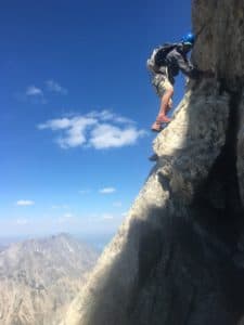 Burke moves along the Owen-Spalding route of the Grand Teton. Burke covered more than 100,000 feet of elevation during a seven-day traverse of the Teton range. (Elizabeth Koutrelakos)