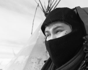 Lott, who goes by the name Big Wind, left Riverton to join the Oceti Sakowin Camp near the Standing Rock Indian Reservation. His tipi is his winter quarters where he flies the Arapaho flag and works with camp security. (Angus M. Thuermer Jr./WyoFile)