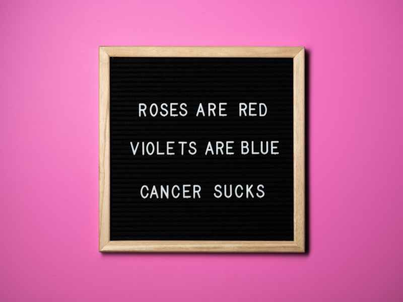 wooden picture frame hanged on pink wall