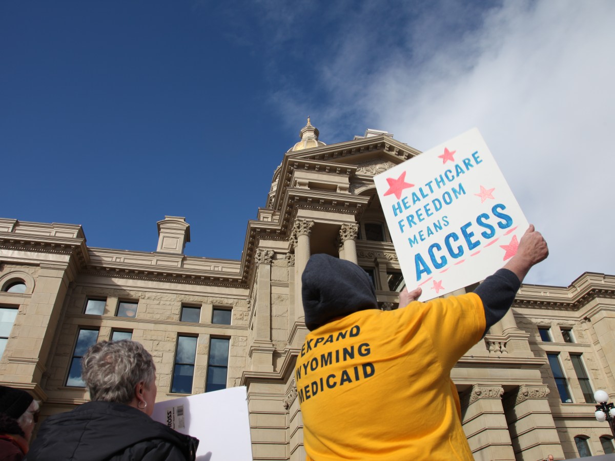 A Medicaid Expansion rally with many people carrying signs in support