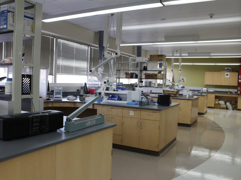 Lab tables are littered with boxes and small mechanical devices