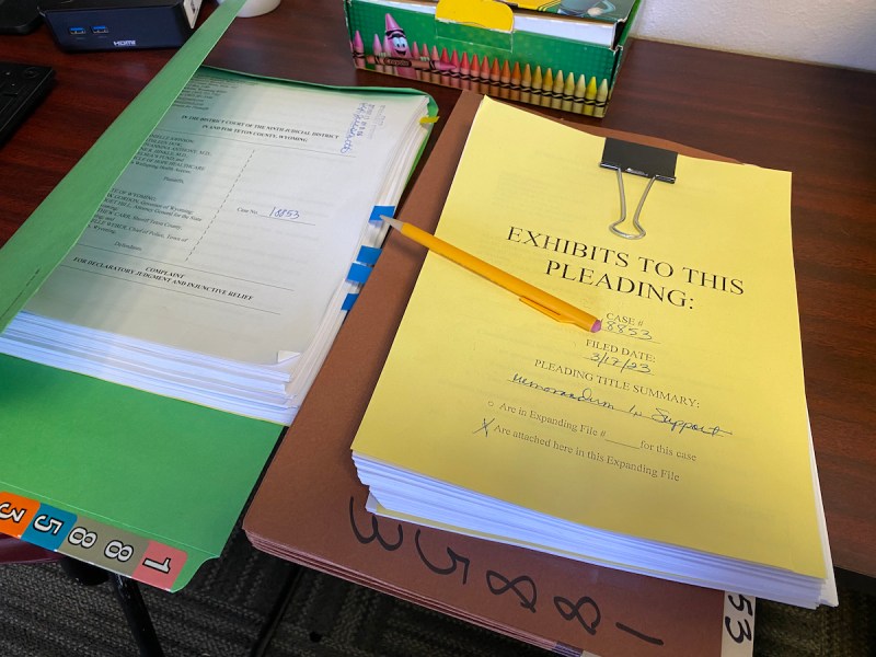 A pile of folders and legal filings