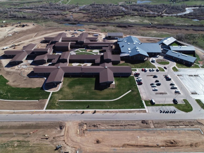 An aerial view of Wyoming State Hospital's new building with several wings and green spaces