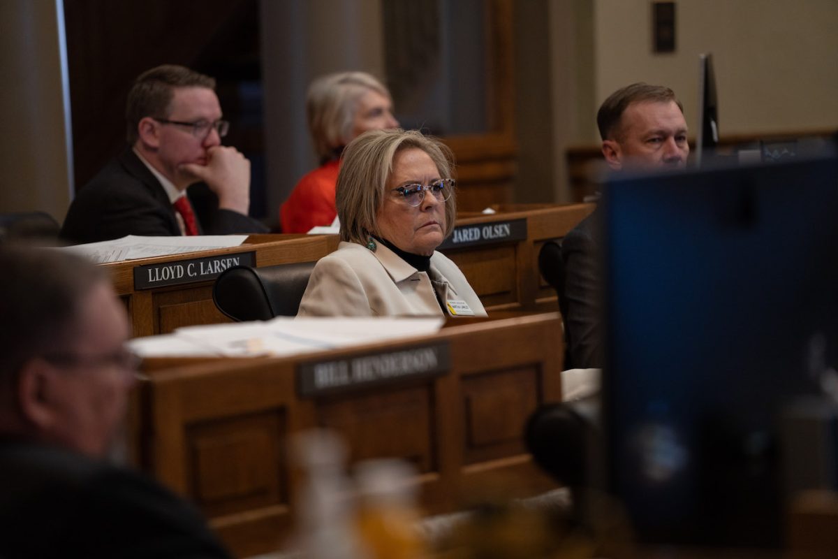 Lawley sits at her wooden desk on the House floor