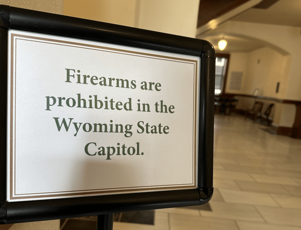 Sign that says "firearms are prohibited in the Wyoming State Capitol"