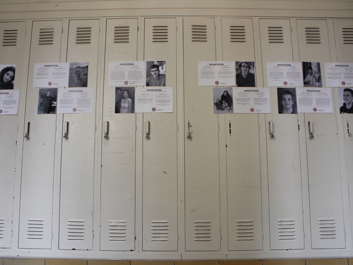 Pictures and descriptions of dead Ukrainian students hang on old lockers at the LPCC