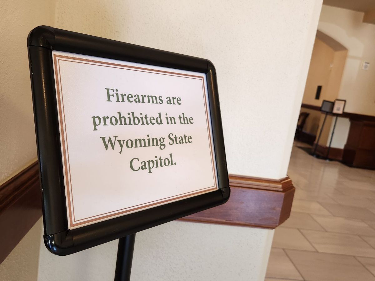 A sign that says "Firearms are prohibited in the Wyoming State Capitol"