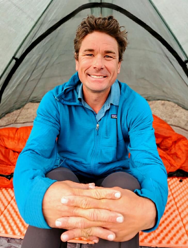 A man sits in a tent