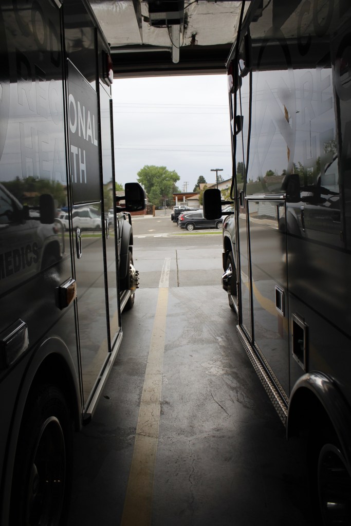 A picture from between two ambulance, looking outside