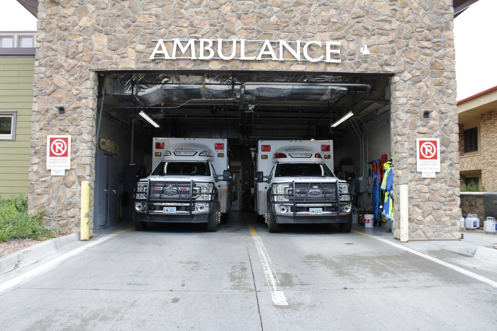 Two ambulances parked in a bay