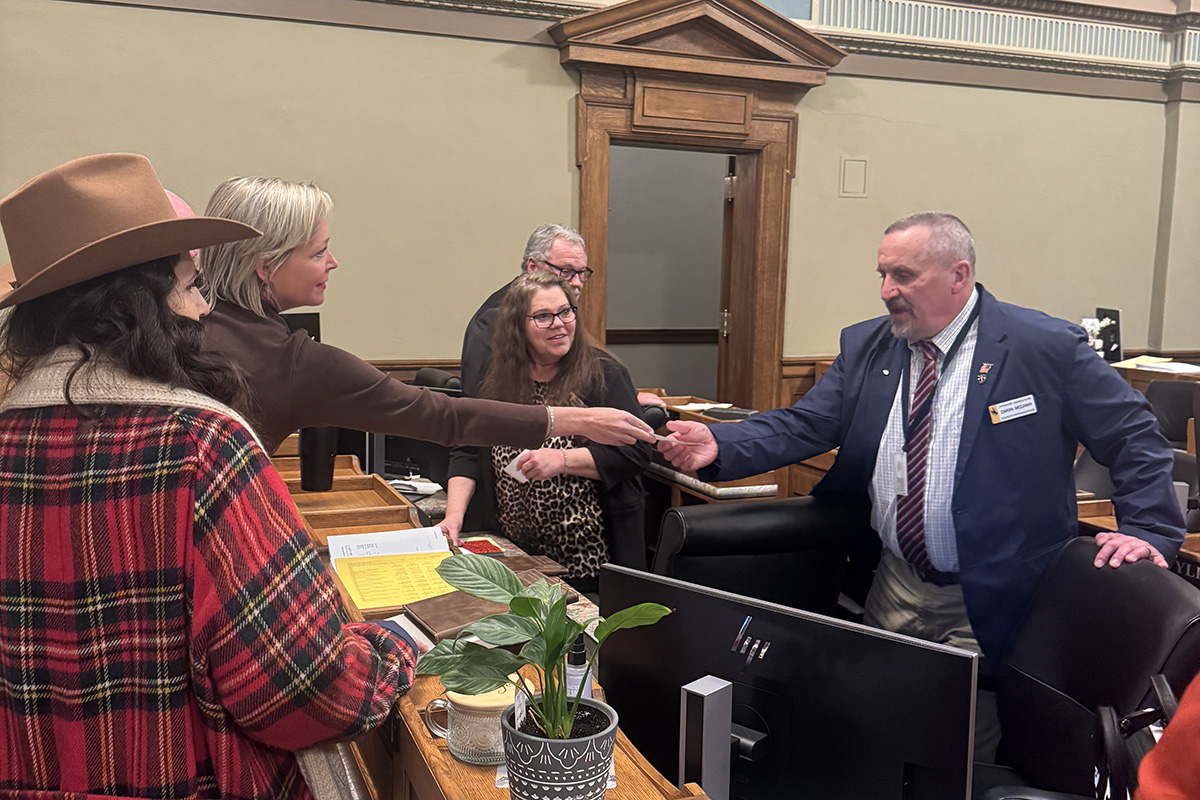 Conservative activist hands checks to lawmakers on Wyoming House floor. Controversy erupts.