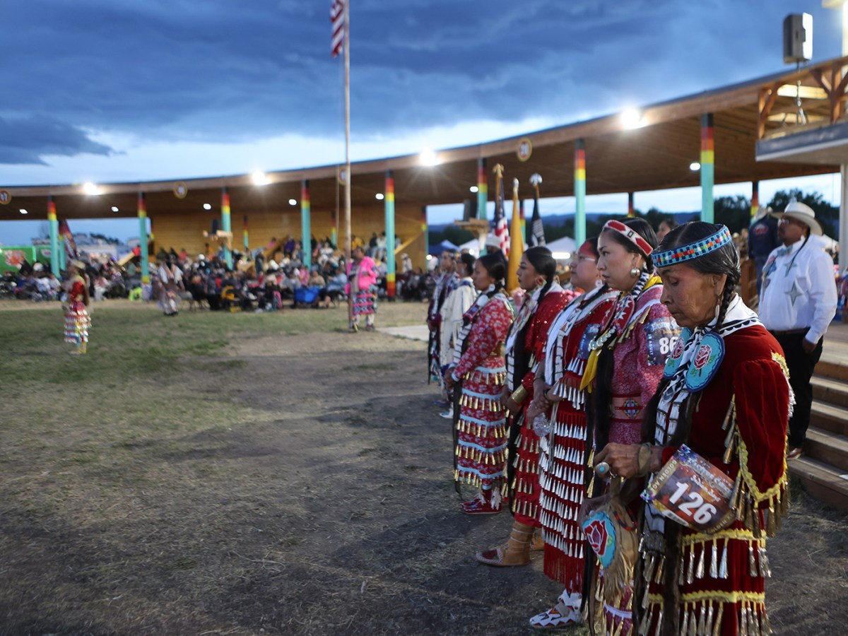 Dancers at Wind River powwow don red regalia to honor grieving families