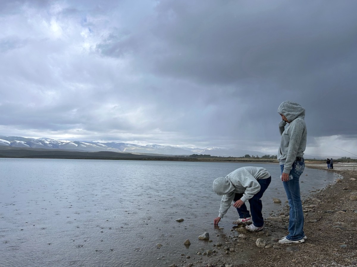 Tribal students in central Wyoming release small fish in a big pond