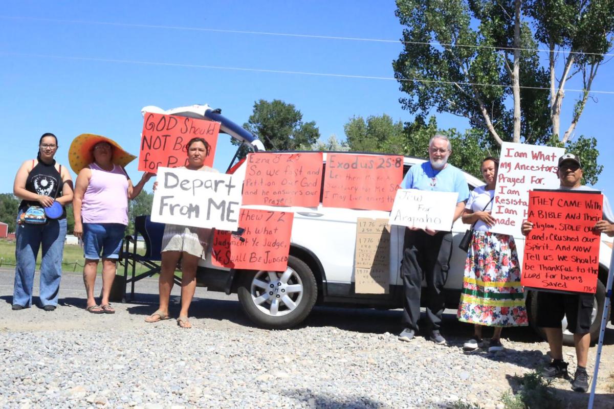 People protest outside the Foundation for Nations Church